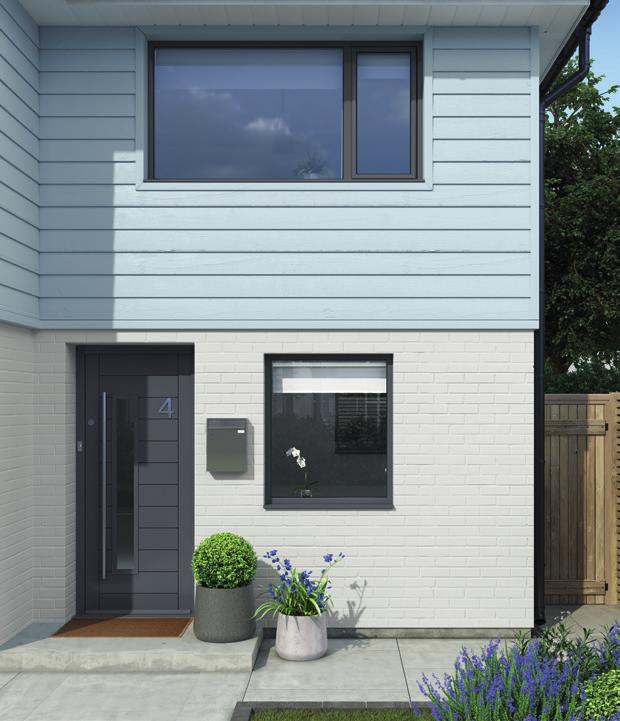 An exterior with cladding in faded denim, masonry in polished pebble and a contrast colour of noble grey
